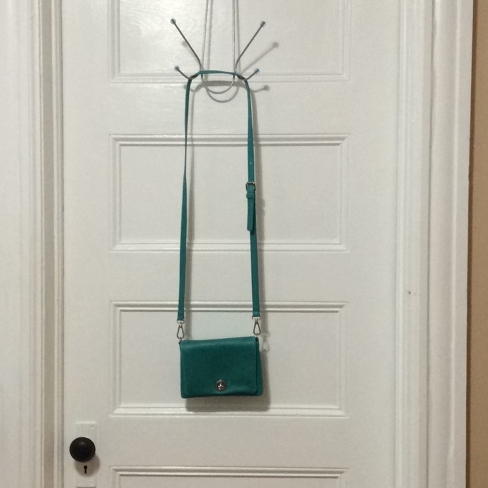 Charming Charlie’s cute turquoise cross body purse